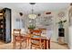 Dining area with wooden table, sliding glass doors, and tiled flooring at 1580 Rosita Dr, Las Vegas, NV 89123