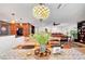Open dining area with direct access to the kitchen and living area, featuring a decorative light fixture at 1580 Rosita Dr, Las Vegas, NV 89123