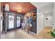 Foyer with unique decorative ceiling, tile flooring, and beautiful wooden furniture at 1580 Rosita Dr, Las Vegas, NV 89123
