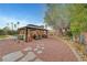 A backyard gazebo is surrounded by drought resistant landscaping and stone paths at 1580 Rosita Dr, Las Vegas, NV 89123