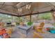 The backyard gazebo features outdoor seating and desert landscaping at 1580 Rosita Dr, Las Vegas, NV 89123