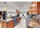 Open concept kitchen featuring granite countertops, custom cabinets, and a direct view into the living area at 1580 Rosita Dr, Las Vegas, NV 89123