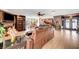 Spacious living room with tile flooring, ceiling fan, and seamless connection to the kitchen at 1580 Rosita Dr, Las Vegas, NV 89123