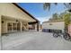 Covered patio features sliding doors, ceiling fan, and rear yard access at 1580 Rosita Dr, Las Vegas, NV 89123