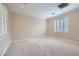 Bright bedroom with neutral carpet, white trim, plantation shutters and natural light at 2385 Orangeburg Pl, Henderson, NV 89044