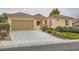 Charming single-story home with a two-car garage, neutral paint, and well-maintained landscaping at 2385 Orangeburg Pl, Henderson, NV 89044