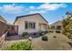Backyard shows desert landscaping and a fence at 2580 Flare Star Dr, Henderson, NV 89044