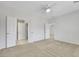 Neutral carpeted bedroom with three doorways and ceiling fan at 2580 Flare Star Dr, Henderson, NV 89044