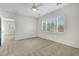 Neutral carpeted bedroom with shuttered window and doorway to the next room at 2580 Flare Star Dr, Henderson, NV 89044