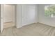 Well-lit bedroom featuring a window with blinds, closet, neutral walls and carpet at 2580 Flare Star Dr, Henderson, NV 89044