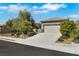 Well-kept single-story home featuring a low-maintenance yard and attached two-car garage at 2580 Flare Star Dr, Henderson, NV 89044