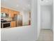 The kitchen boasts stainless steel appliances and flows into the entryway of the home at 2580 Flare Star Dr, Henderson, NV 89044