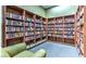 Cozy reading area with bookshelves filled with books and a comfortable armchair at 2580 Flare Star Dr, Henderson, NV 89044