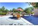 Relax and unwind in the community patio area, complete with comfortable seating and lush landscaping for a peaceful retreat at 2580 Flare Star Dr, Henderson, NV 89044