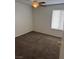 A bedroom featuring neutral walls, carpeted floors, and a ceiling fan for comfort at 259 E Van Wagenen St # 259, Henderson, NV 89015
