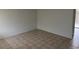 A bright living room with neutral walls and tiled flooring leading to an outdoor patio space at 259 E Van Wagenen St # 259, Henderson, NV 89015