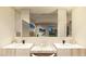 Bathroom vanity with double sinks and backyard view at 2630 Juniper Branch St, Las Vegas, NV 89117
