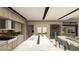 Stylish kitchen with a large island, sleek cabinetry, and dining area at 2630 Juniper Branch St, Las Vegas, NV 89117