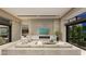Open living room boasts a fireplace with stone surround and expansive sliding glass doors at 2630 Juniper Branch St, Las Vegas, NV 89117