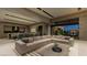 Spacious open-concept living area features a large sectional sofa and gourmet kitchen at 2630 Juniper Branch St, Las Vegas, NV 89117