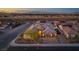 Beautiful home with desert landscape and a view of the city skyline in the distance at 3012 Joy Meadow Ave, Henderson, NV 89074