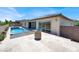 Backyard with pool, spa, and tiled patio area offering an inviting outdoor space at 3012 Joy Meadow Ave, Henderson, NV 89074
