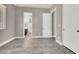 Neutral-toned bedroom with doors, closet, window with blinds, and tiled flooring at 3012 Joy Meadow Ave, Henderson, NV 89074