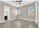 Inviting bedroom with plenty of natural light, tiled flooring, and a door leading to the Primary bath at 3012 Joy Meadow Ave, Henderson, NV 89074