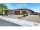 Spacious single-Gathering home with a three car garage, desert landscaping, and paved driveway at 3012 Joy Meadow Ave, Henderson, NV 89074