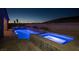 Backyard swimming pool with a spa and decorative lighting, perfect for evening relaxation at 3012 Joy Meadow Ave, Henderson, NV 89074