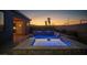Backyard swimming pool and spa with beautiful landscape and mountain view at sunset at 3012 Joy Meadow Ave, Henderson, NV 89074