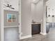 Stylish wet bar featuring dark cabinets, granite countertop, and open access to the room at 3012 Joy Meadow Ave, Henderson, NV 89074