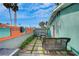 Landscaped backyard featuring stone walkway, garden beds, and desert foliage at 3220 Pawnee Dr, Las Vegas, NV 89169