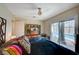 Cozy bedroom featuring a modern ceiling fan, access to the pool area through a sliding glass door, and stylish decor at 3220 Pawnee Dr, Las Vegas, NV 89169