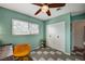 Cozy bedroom featuring a large window, ample closet space, and ceiling fan at 3220 Pawnee Dr, Las Vegas, NV 89169