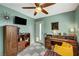 Stylish bedroom with unique décor, wood furnishings, and a ceiling fan at 3220 Pawnee Dr, Las Vegas, NV 89169