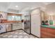 Bright kitchen featuring stainless steel appliances, white cabinetry and blue backsplash, perfect for cooking at 3220 Pawnee Dr, Las Vegas, NV 89169