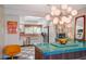 Bright kitchen with a large window, stainless steel appliances, and an island with a unique green countertop at 3220 Pawnee Dr, Las Vegas, NV 89169