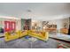 Spacious living room flows into the dining area, featuring bright furniture, and playful accents throughout at 3220 Pawnee Dr, Las Vegas, NV 89169