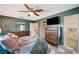 Bedroom view includes a ceiling fan, wood dresser, and ensuite bath at 3220 Pawnee Dr, Las Vegas, NV 89169