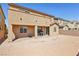An empty backyard with potential, featuring a covered patio and space for outdoor activities and landscaping at 3903 Henny Ave, Las Vegas, NV 89141