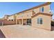 Spacious backyard featuring a covered patio and ample room for outdoor activities and custom landscaping at 3903 Henny Ave, Las Vegas, NV 89141