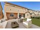 A cozy backyard patio featuring stylish furniture and a well-maintained lawn for outdoor relaxation at 3903 Henny Ave, Las Vegas, NV 89141