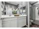 Stylish bathroom featuring double sinks, floral decor, and a shower-tub combo at 3903 Henny Ave, Las Vegas, NV 89141