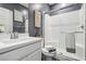 Clean bathroom with a glass-enclosed shower, white subway tile, and modern fixtures at 3903 Henny Ave, Las Vegas, NV 89141