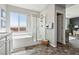 Bright bathroom featuring a soaking tub, glass enclosed shower and contemporary fixtures at 3903 Henny Ave, Las Vegas, NV 89141