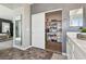 Bathroom view showcasing a walk-in closet with sliding doors and built-in shelving at 3903 Henny Ave, Las Vegas, NV 89141