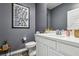 Chic powder room featuring a modern vanity, stylish mirror, and trendy decor for a contemporary feel at 3903 Henny Ave, Las Vegas, NV 89141