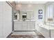 Bathroom featuring double vanity, soaking tub, and contemporary fixtures at 3903 Henny Ave, Las Vegas, NV 89141