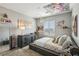 Bright and airy bedroom featuring stylish furnishings and a window at 3903 Henny Ave, Las Vegas, NV 89141